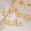 Austrália e antigo venda cruzada de nicho de luxo banhado a cobre ouro 18K 26 letras inglesas anel de zircônia anel joker feminino