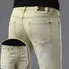 Marca europea de alta gama de moda, nuevos jeans ajustados skinny elásticos para hombre de otoño e invierno con forro polar y diseño engrosado