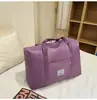 2025 bolsa de almacenamiento para ropa de mudanza acolchada de doble capa transfronteriza bolsa de equipaje portátil con ruedas al por mayor