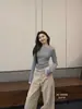 Llegada Nueva de Otoño Guangzhou Trece Líneas HUMSMR2026: Camiseta de Manga Larga Adelgazante Versátil de Bloques de Color Falso Dos Piezas C6580