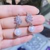 Brincos de pérola clássicos personalizados com asas de anjo para mulheres, estilo coreano e japonês, brincos versáteis e modernos, brincos elegantes inspirados em celebridades da internet.