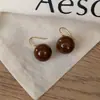 Pendientes de Botón Ovalados de Resina Transfronterizos Europeos y Americanos Pendientes Maillard de Otoño e Invierno Pendientes Simples de Moda Versátiles para Mujer Sensación de Alta Gama
