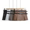 Falda de cuero PU negra estilo retro americano para mujer, nueva falda mini de cintura alta con doble cinturón de otoño