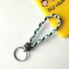 Llavero creativo de cuerda de cuero tejido a mano para pareja, llavero de coche, llavero al por mayor, colgante para bolso