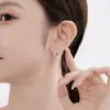 Pendientes de Aro Geométricos con Diseño de Flor de Círculo Xuping Aleación de Cobre Chapado en Blanco Pendientes de Aro Transfronterizos Europeos y Americanos para Mujer