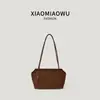 Nuevo bolso de axila de gamuza transfronterizo otoño/invierno, un bolso de mano retro versátil y elegante para el uso diario, adecuado tanto para ocasiones casuales como de trabajo.