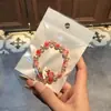 Libro Caperucita Roja Mismo Estilo Estudiante Pulsera de Glaseado de Palomitas de Maíz Hecha a Mano con Cuentas Dibujos Animados Cristal Pulsera Infantil Venta al por Mayor Cajas de Regalo