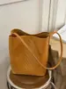 Bolsa Saco de Cor Sólida com Padrão Trançado para Mulheres Moda Verão 2026 Nova Bolsa de Mão Casual para Trabalho e Deslocamento Bolsa de Ombro
