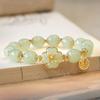Pulsera de flor de durazno feliz diseño de nicho ins femenino elegante alto sentido Pulsera de trébol imitación jade Hetian femenino