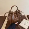 Bolsa de Hombro Plegada Nueva Otoño e Invierno 2025 Transfronteriza para Viajar al Trabajo Bolso de Mano Texturizado para Mujer Bolso Cruzado Bolso Cubo Casual