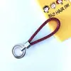Chaveiro de corda trançada com anel duplo chaveiro de couro PU colorido novo pingente para bolsa feminina chaveiro para pendurar na cintura