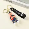 Llavero de Silicona Estrella de Fútbol Copa Mundial 2026 EE. UU.-Canadá-México Figura de Dibujos Animados Colgante para Coche Venta al por Mayor