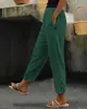 Pantalones nuevos de primavera y otoño transfronterizos europeos y americanos para mujer, color liso de algodón y lino, pantalones casuales de moda para uso diario, pantalones casuales con botón lateral, cintura elástica para mujer