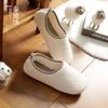 Estilo japonês inverno simples casa interior piso de madeira impermeável antiderrapante mudo masculino e feminino casal bolsa com chinelos de algodão espesso
