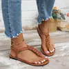 Elegantes sandalias planas tejidas de estilo francés, nuevo modelo de verano 2026, sandalias romanas versátiles de moda europea y americana