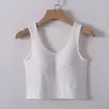 Una generación de pelo con almohadilla en el pecho, cuello en V, tirante para el ombligo, chaleco corto fino de verano para mujer, puede usarse por fuera