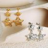 Pendientes femeninos de lujo con diseño de nicho europeo y americano, con incrustaciones de estrella de cinco puntas, circonita brillante, acero de titanio, personalidad dulce y temperamento ligero.