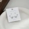 Aguja de plata S925 corazón de melocotón lazo una tarjeta tres pares de pendientes de botón para mujer diseño simple nuevo conjunto de tres piezas pendientes moda venta al por mayor