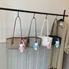 Bolso de hombro minimalista nuevo transfronterizo, elegante y versátil, un bolso de mano de estilo coreano moderno y elegante para mujer, perfecto como bolso de axila