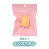 Venta al por mayor de huevos de belleza directos de fábrica empaque independiente gota de agua corte oblicuo puff de doble uso seco y húmedo huevo de calabaza para maquillaje puff