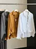 Otoño 2026 Nuevo Estilo Casual Simple Holgado Camisa Bordada de Mujer Francesa con Volantes y Cuello en V A14096