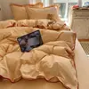 2026 Novo Modelo 100% Algodão Algodão Lavado 40S com Costura de Borda Densa Cor Sólida Conjunto de Quatro Peças - Série Borda de Nuvem Estilo Lençol de Cama 1,2m Três