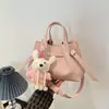 Bolso retro de nicho para mujer, nuevo y moderno 2026, bolso tipo cubo casual versátil, bolso cruzado simple para el trabajo, madre e hija