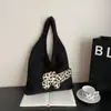 Bolsas Outono e Inverno 2025 Nova Bolsa Tote de Tricô Nicho Bolsa de Ombro Feminina Grande Capacidade Bolsa de Mão Casual Bolsa para o Trabalho