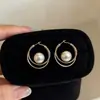 Elegante HerederaEstilo Fresco Bolso de Lunares Plateados Arete Arete Único Mujer 2026 Aretes Súper Hermosos