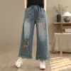 Coleção Primavera 2026 Jeans Feminino Estilo Étnico Cintura Elástica Bordado Solto Moda Emagrecedor Cropped Calças de Perna Larga
