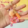 Chaveiros de letra com pompom estilo europeu e americano, chaveiros de letra em formato de coração de resina de cristal para meninas