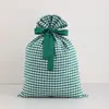 Bolsa de algodón con cordón a cuadros navideña creativa personalizada más vendida transfronteriza bolsa de regalo de Navidad fácil de tirar