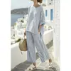 Nuevo conjunto casual de vacaciones a rayas transfronterizo, conjunto de top de manga corta y pantalones largos, atuendo de dos piezas suelto de verano
