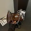 Bolso para axila súper popular transfronterizo, nuevo modelo otoño 2026, moderno y versátil, gran capacidad, diseño de cadena, alto valor estético, bolso de hombro y cruzado