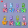Llavero de resina de mariposa en colores candy con colgante de mariposa floral pintado, charm para bolso femenino, llavero de cuentas para DIY
