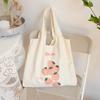 Bolsa de lona de ombro único de nicho Bolsa de ombro único feminina Bolsa de colete de morango de moda fofa Estudantes Bolsa de lona artística de grande capacidade