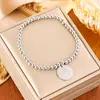 Pulsera elástica de cuentas redondas para mujer, Acero de titanio chapado en oro de 18 quilates, Colgante de moneda de alta gama, Joyería de pulsera versátil de estilo de lujo ligero
