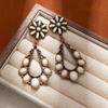 Pendientes de gota de agua turquesa hueca europea y americana, pendientes de flores retro bohemias avanzadas, pendientes retro de estilo occidental