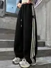 Pantalones Deportivos Casuales con Raya Lateral para Niñas Primavera y Otoño 2025 Nuevos Pantalones Rectos de Pierna Ancha de Moda para Niños Mayores