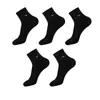 Calcetines empaquetados individualmente calcetines de media pantorrilla para hombre otoño e invierno absorbentes de sudor transpirables calcetines de media pantorrilla para hombre de negocios color liso antiolor Zhuji