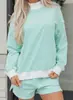 Traje casual holgado de tendencia de moda europea y americana para mujer, nuevo conjunto de dos piezas a rayas de manga larga para invierno 2025 para mujer