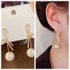 Pendientes de perlas con lazo de diamantes de imitación estilo Chanel, ligeros y lujosos, para damas de temperamento suave, de gran sentido, nuevos