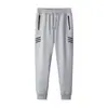Pantalones de chándal para hombre Primavera y Otoño Nuevos Bolsillo con Cremallera Pantalones Antirrobo Delgados Rectos Sueltos Versátiles Joggers