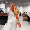 Estilo Minimalista Feito à Mão Corda Trançada Bloqueio de Cores Cordão Chaveiro Capa de Celular Alça de Pulso Portátil DIY Tendência Acessório de Nicho