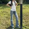 Jeans acampanados de tiro bajo de alta calle americanos para mujer, nuevo estilo de verano con un diseño único para chicas a la moda, corte ajustado, versátiles y elásticos