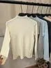 Diseño de cuello semi-alto, suéter de punto de manga larga para mujer, nueva colección otoño/invierno 2026, top básico adelgazante y versátil, moderno