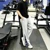 Calça casual xadrez patchwork estilo novo de primavera para homens, marca americana da moda, corte solto, perna reta levemente alargada, calça esportiva casual, moderna