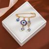 Olhos europeus e americanos altura da cintura suéter azul de alta qualidade vento frio alfinete criativo diamante olho de demônio franja broche