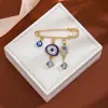 Broche de Borla Ojo del Diablo con Pedrería Creativa Europeo y Americano para Mujer, Pin de Estilo Vintage para Ceñir la Cintura de Suéter Ojo Azul de Alta Gama