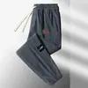 Pantalones de chándal de pana para hombre para otoño, pantalones casuales de retazos, corte holgado, pantalones jogger versátiles y modernos, pantalones largos para hombre